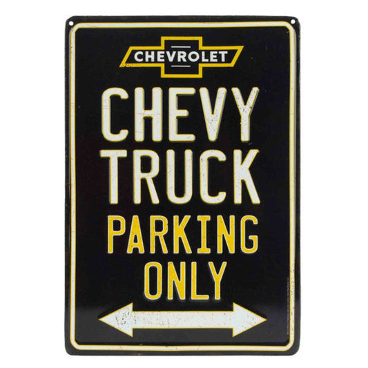 "Chevy Truck Parking Only" embossed on a black tin sign with the Chevrolet logo and a directional arrow, signaling a reserved parking spot for Chevy trucks.