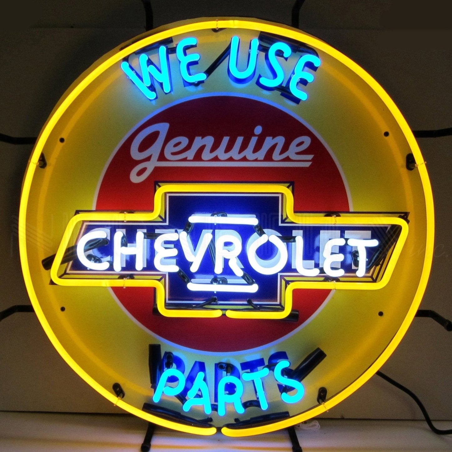 "Chevrolet We Use Genuine Parts" neon sign with bold yellow and blue colors.