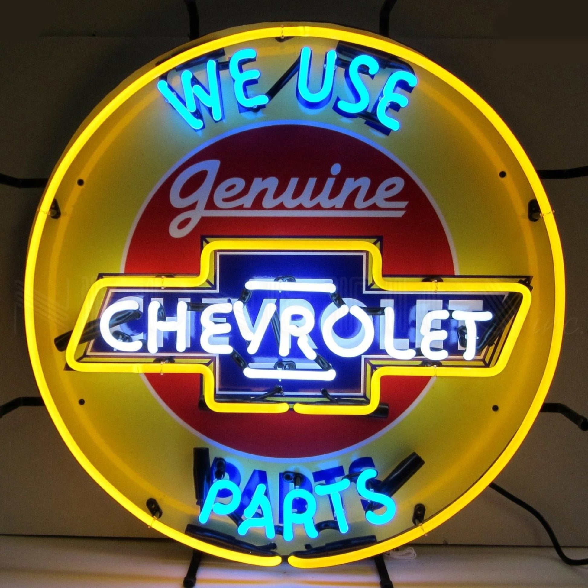 "Chevrolet We Use Genuine Parts" neon sign with bold yellow and blue colors.