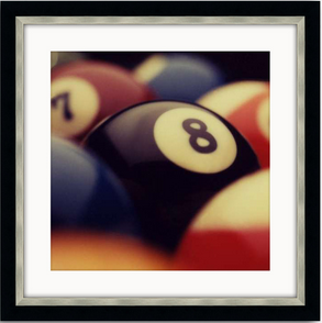 Close-up-framed-artwork-of-billiard-balls-with-prominent-8-ball-ideal-for-game-room-decor