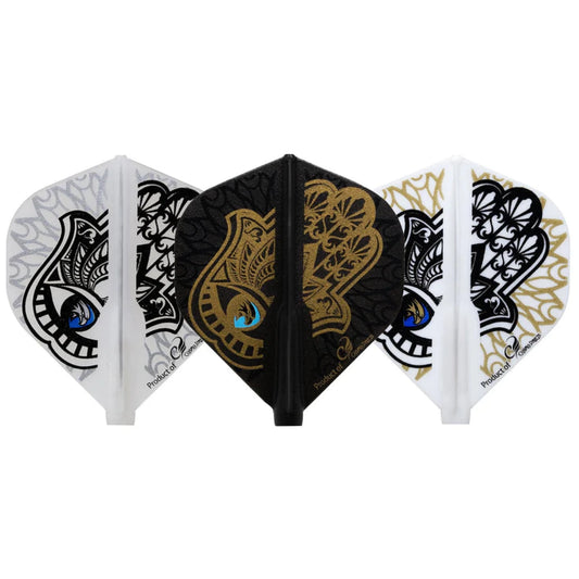 A set of three dart flights. One is black with a gold and blue Hamsa hand with an eagle head depicted in the iris. The other two are white with a black Hamsa hand, with a darker blue in the iris and the same eagle head. One of the white flights features silver detail behind the Hamsa hand, while the other features the same linework in gold.