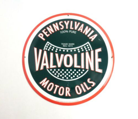 Retro-style "Valvoline Motor Oils" round tin sign featuring traditional Valvoline branding in red and green on a black background.