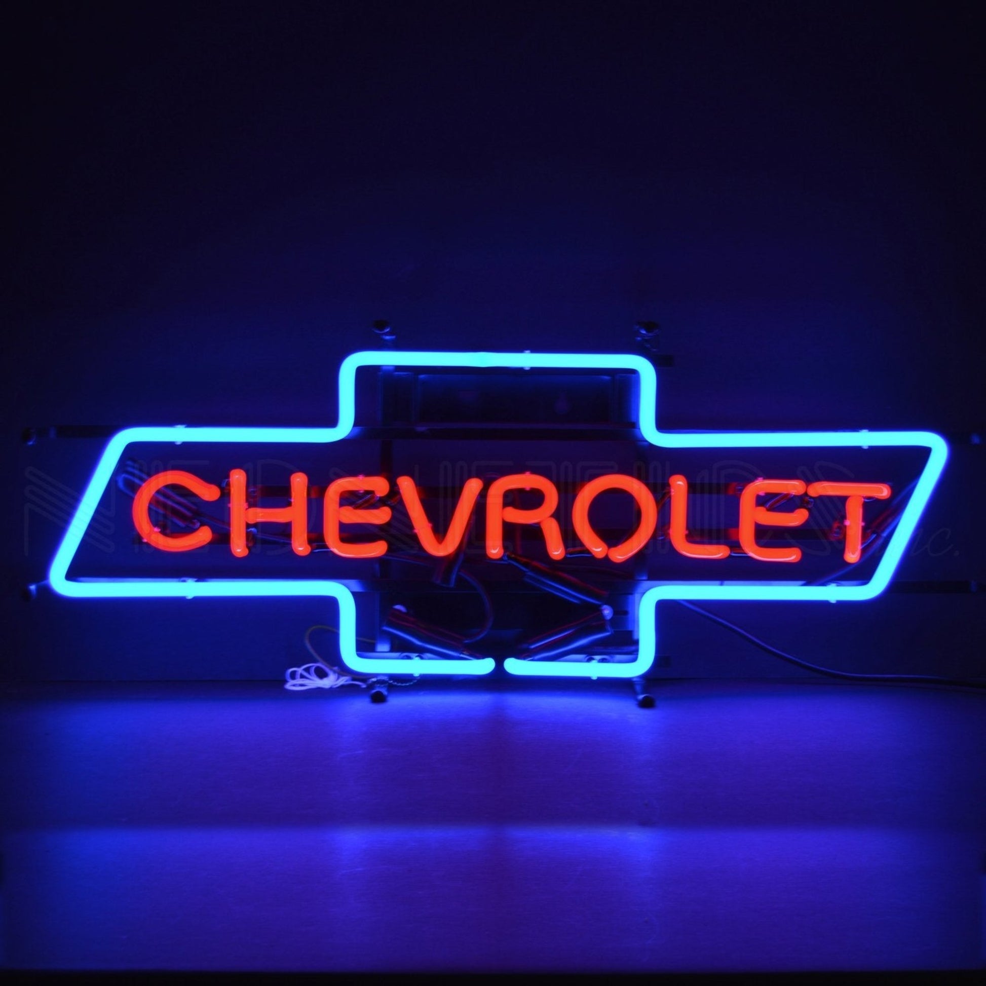 "Chevrolet Bowtie" neon sign in striking red and blue.