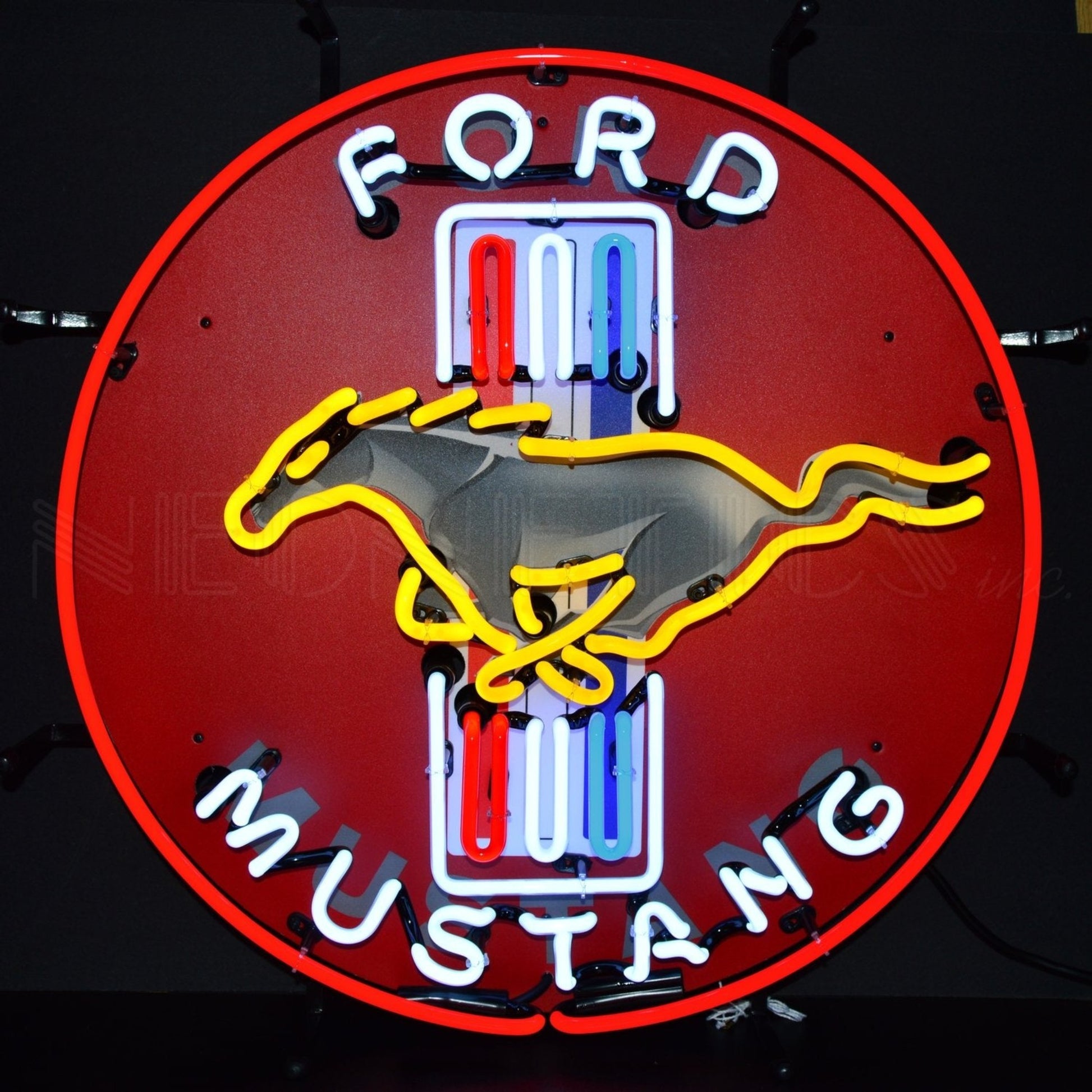 Vibrant Ford Mustang Neon Sign with the iconic galloping horse logo and multicolored lettering on a red background, perfect for any muscle car enthusiast's decor.