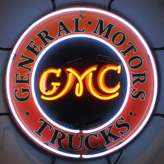 "General Motors GMC Trucks" vintage neon sign with bright orange and green colors