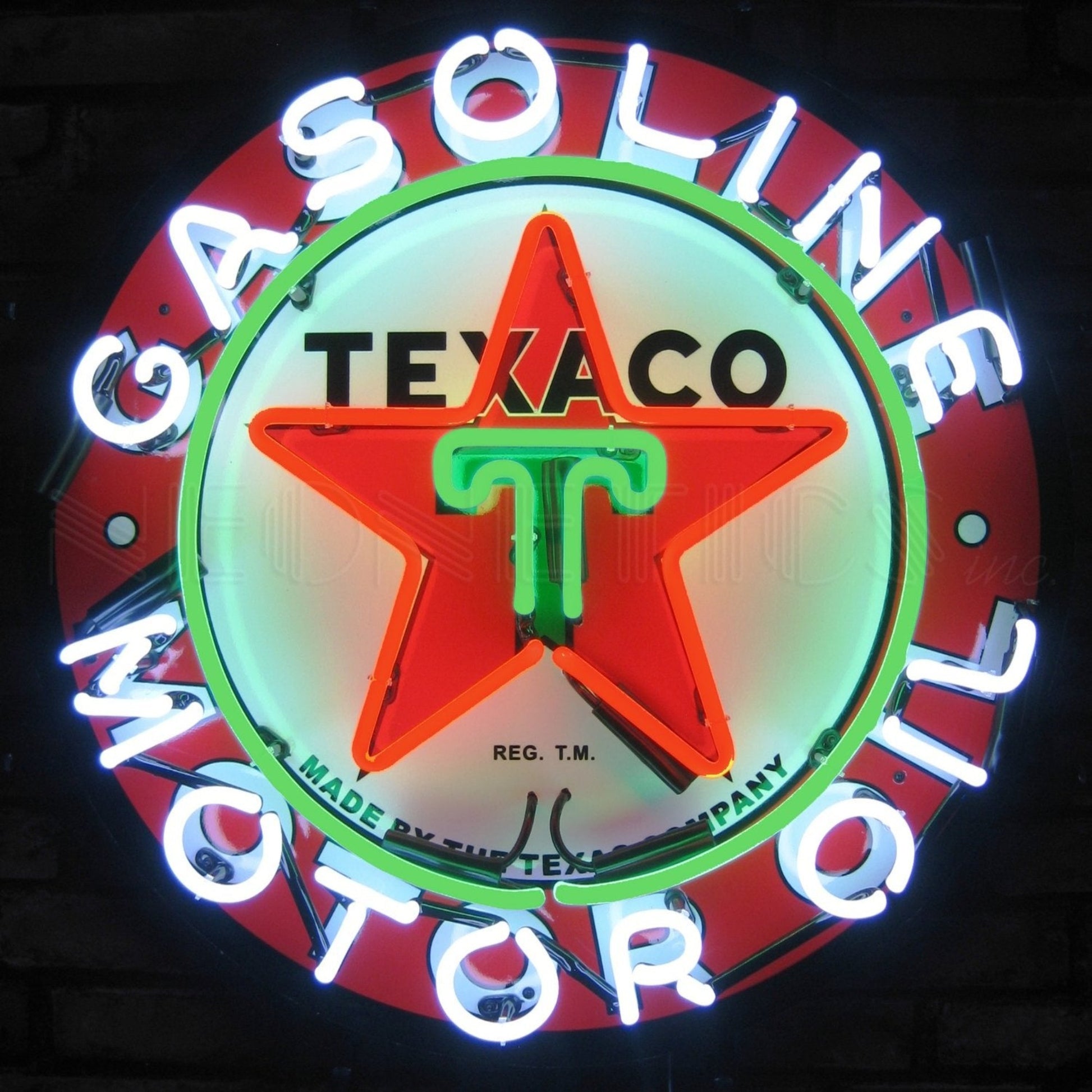Texaco Motor Oil Neon Sign with a vibrant display of red, green, and white lights, a retro tribute to the classic American oil company.